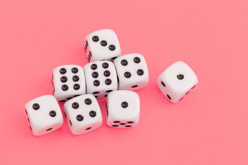 Gaming dice on pink background. Concept for games.