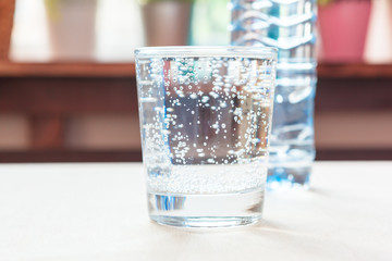 Glass of pure water on kitchen table