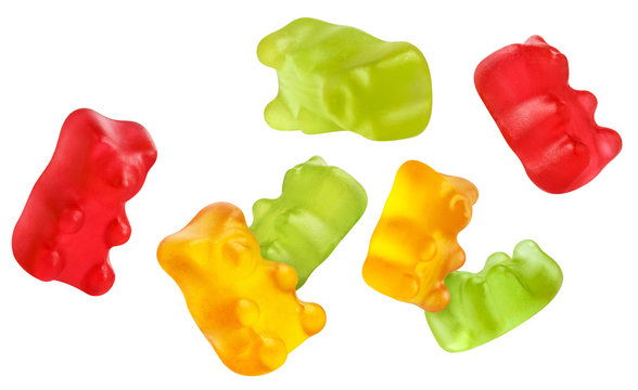 Flying colorful jelly gummy bears, isolated on white background