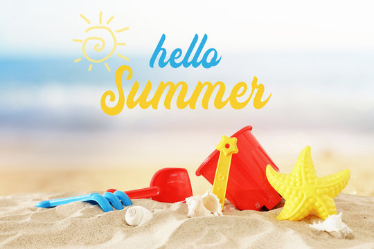 holidays. vacation and summer image with beach colorful toys for kid over the sand