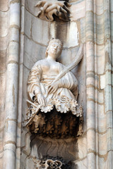Obraz premium Statue of Saint on the facade of the Milan Cathedral, Duomo di Santa Maria Nascente, Milan, Lombardy, Italy