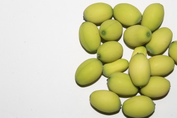 Lotus (Nelumbo nucifera) seeds against white background.Also known as sacred lotus, bean of India, Egyptian bean