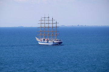 Fototapeta na wymiar Big sailboat with five masts anchored in front of Portoroz, Slovenia