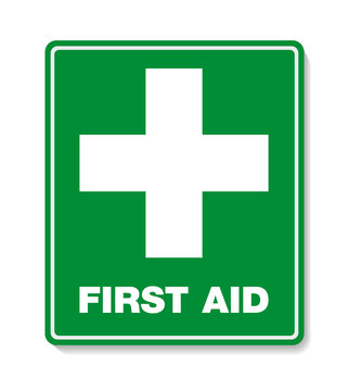 green FIRST AID sign with text and cross symbol