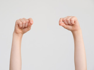 Child's hands   hold nothing/ shows a pinch;