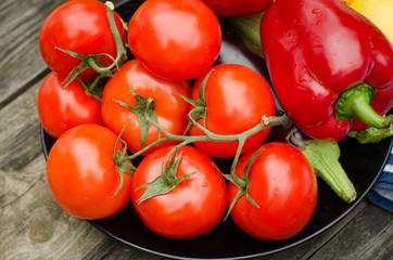 Still life of fresh organic vegetables on wooden plate, selective focus, close-up
