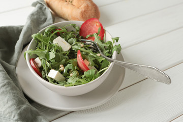 salad with feta cheese, tomatoes and pine nuts