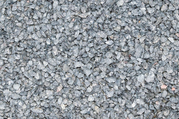 Granite crumb texture. Grey gritty rock surface. Non polished white granite as a background,