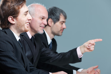 Three businessman in a meeting in the office