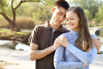 Portrait of young couple outdoors