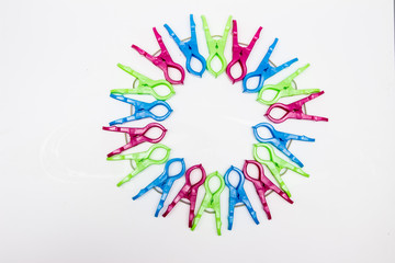 cool colorful clothespins on a white background