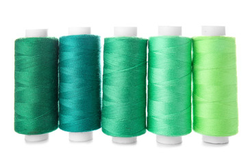 Colorful sewing threads on white background