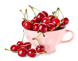 Obraz na płótnie Canvas Cup with sweet ripe cherry on white background