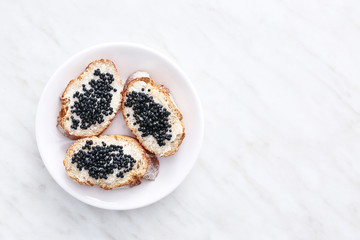 Obraz na płótnie Canvas Sandwiches with delicious caviar on light table