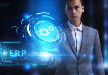 The concept of business, technology, the Internet and the network. A young entrepreneur working on a virtual screen of the future and sees the inscription: ERP