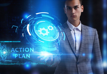 The concept of business, technology, the Internet and the network. A young entrepreneur working on a virtual screen of the future and sees the inscription: Action plan