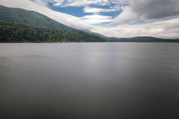 scenic view on beautiful intermittent lake cerknica, with water in long exposure, spring season, slovenia