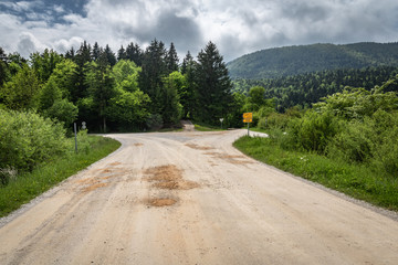 beautiful empty macadam road with crossroads, in cerknica, Slovenia