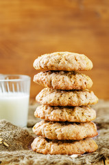 Oatmeal cookies with oats and glass of milk