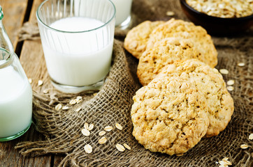 Oatmeal cookies with oats and glass of milk