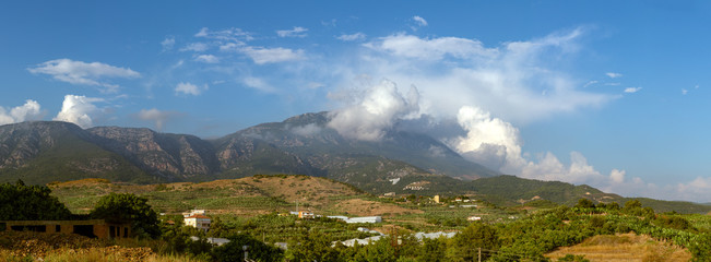 Dim River National Park mountain range in the clouds. Panoramic landscape of mountains with cloudscape.