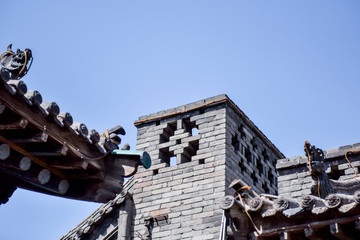 Ancient Chinese Architectural Gateway Wall under Clear Sky and White Cloud, Pingyao County,...