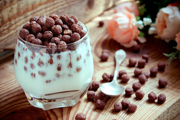 chocolate multislake balls with milk in a glass. delicious sweet breakfast