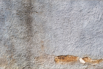Cracked plaster wall as abstract background