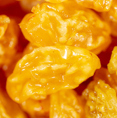 Yellow raisins as background