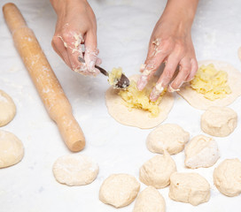 The hostess prepares the pies in the kitchen