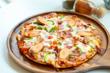 Homemade pizza on wooden tray