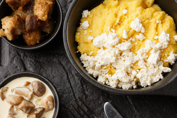 Typical Ukrainian dish polenta - Banosh with cheese and lard. Ukrainian cuisine. maize porridge...