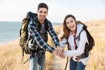 Naklejka premium Happy young loving couple outside in free alternative vacation camping.