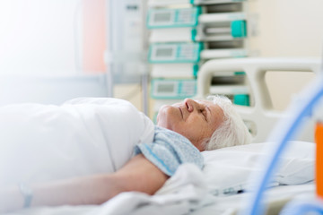 Senior female patient in hospital bed - Powered by Adobe