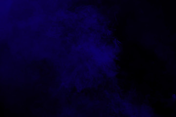 Abstract blue smoke on black background. Blue color clouds.