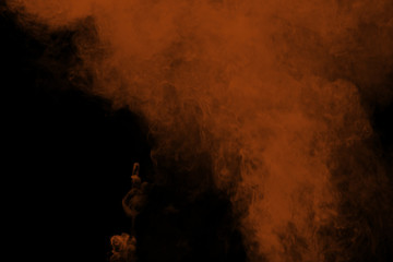 Abstract brown smoke on black background. Brown color clouds.