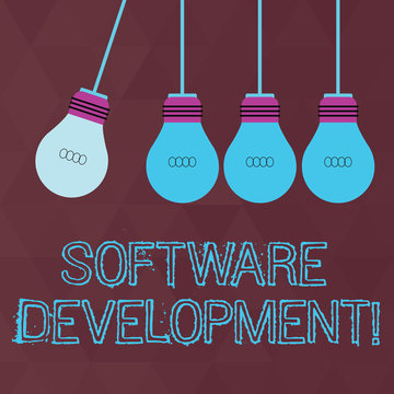 Conceptual hand writing showing Software Development. Concept meaning software is created using a specific programming Color Pendant Bulb Hanging with One Different Shade Lightbulb