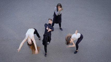 People performing dance on road