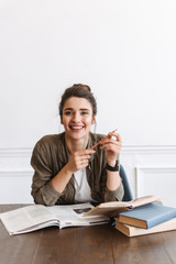 Attractive young girl student doing homework