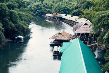 Many wooden house floating on the river
