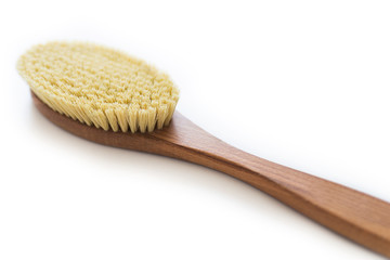 Spa organic brush for dry massage on white background with copy space. Cactus brush. Anti-cellulite massage. Spa beauty concept.