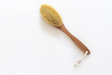 Spa organic brush for dry massage on white background with copy space. Cactus brush. Anti-cellulite...