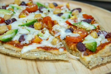  Italian pizza, vegetables, ingredients background. Pizza is cooking in the oven.