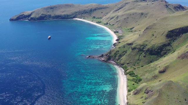 A beautiful coral reef fringes the scenic island of Gili Banta just outside of Komodo National Park. This area of Indonesia is known for its spectacular tropical marine biodiversity.