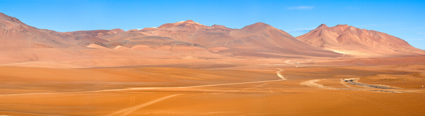 Fototapeta na wymiar Road and paths in the Altiplano at an altitude of 4600m, Atacama desert, Chile, South America
