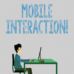 Text sign showing Mobile Interaction. Business photo showcasing the interaction between mobile users and computers Businessman Sitting Straight on Chair Working on Computer and Books on Table