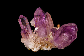 Macro of amethyst mineral stone on black background