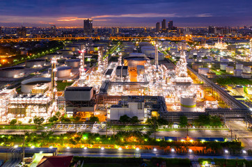 Aerial view of twilight of oil refinery ,Shot from drone of Oil refinery plant ,refinery Petrochemical plant at dusk , Bangkok, Thailand.