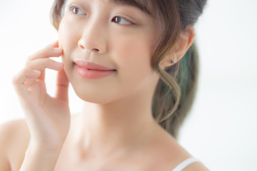 Portrait of beautiful young asian woman smile while wake up healthy and wellness with sunrise at morning in the bedroom, asia girl skin care with happy with fresh, lifestyle and relax concept.