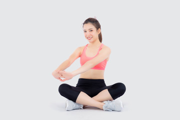 Fototapeta premium Beautiful portrait young asian woman sitting stretch muscle arm isolated on white background, girl wear sport clothes exercise and yoga for health, wellness concept.